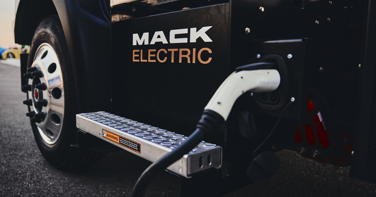 Mack electric truck being charged at a depot