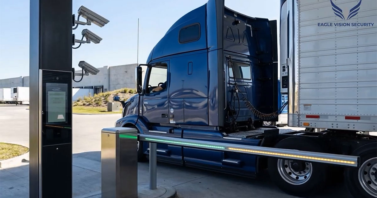 A truck being scanned by an AI-powered system for damage detection in a fleet facility.