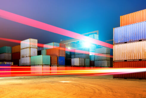 A container ship at sea, emphasizing the global nature of shipping.