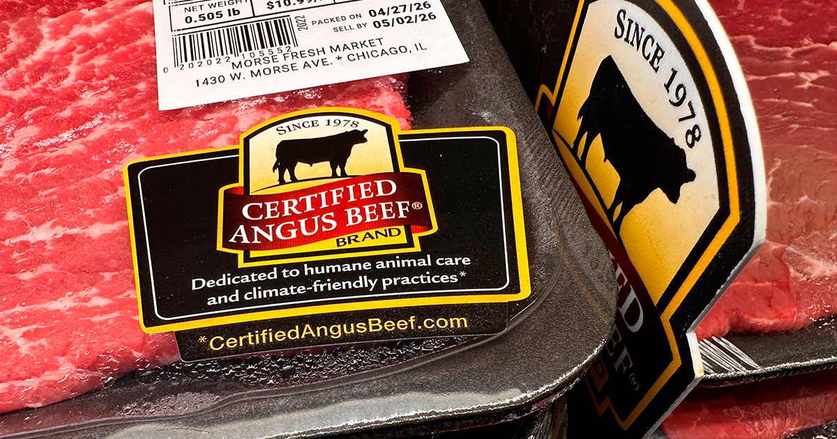 A close-up shot of a package of raw ground beef on a kitchen counter.
