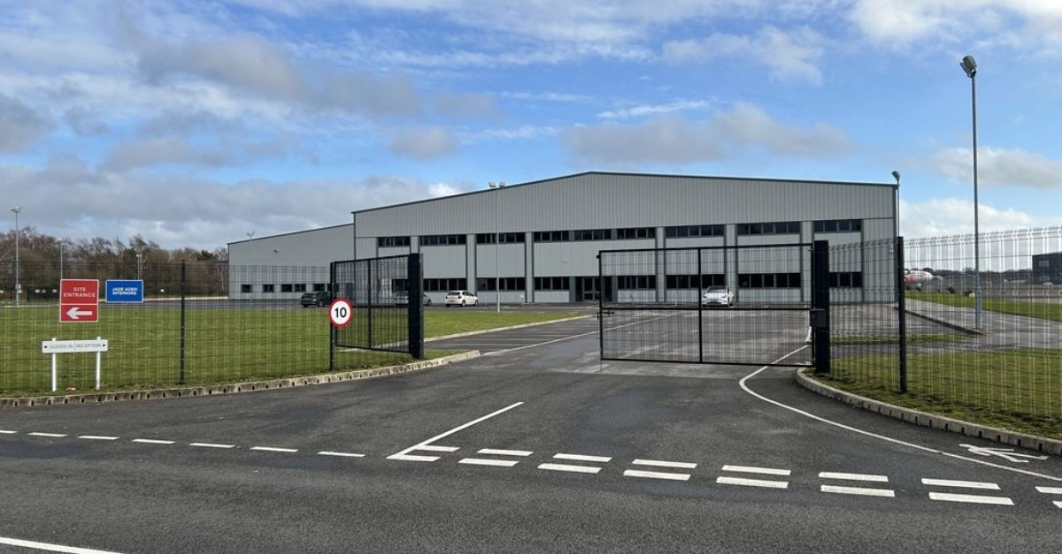 Aerial view of Aviation Business Park warehouse at Bournemouth Airport with Yunex Traffic signage