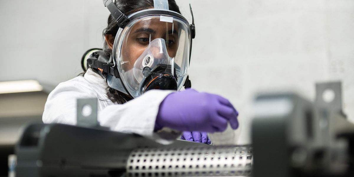 Battery electrode coating machine in a modern factory, showing dry process powders on foil
