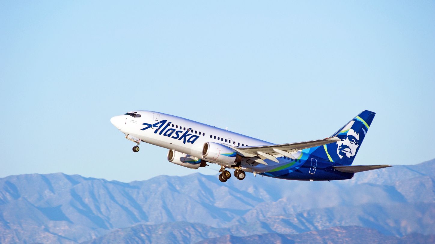 Alaska Airlines and Hawaiian Airlines aircraft on tarmac, representing merged cargo operations.
