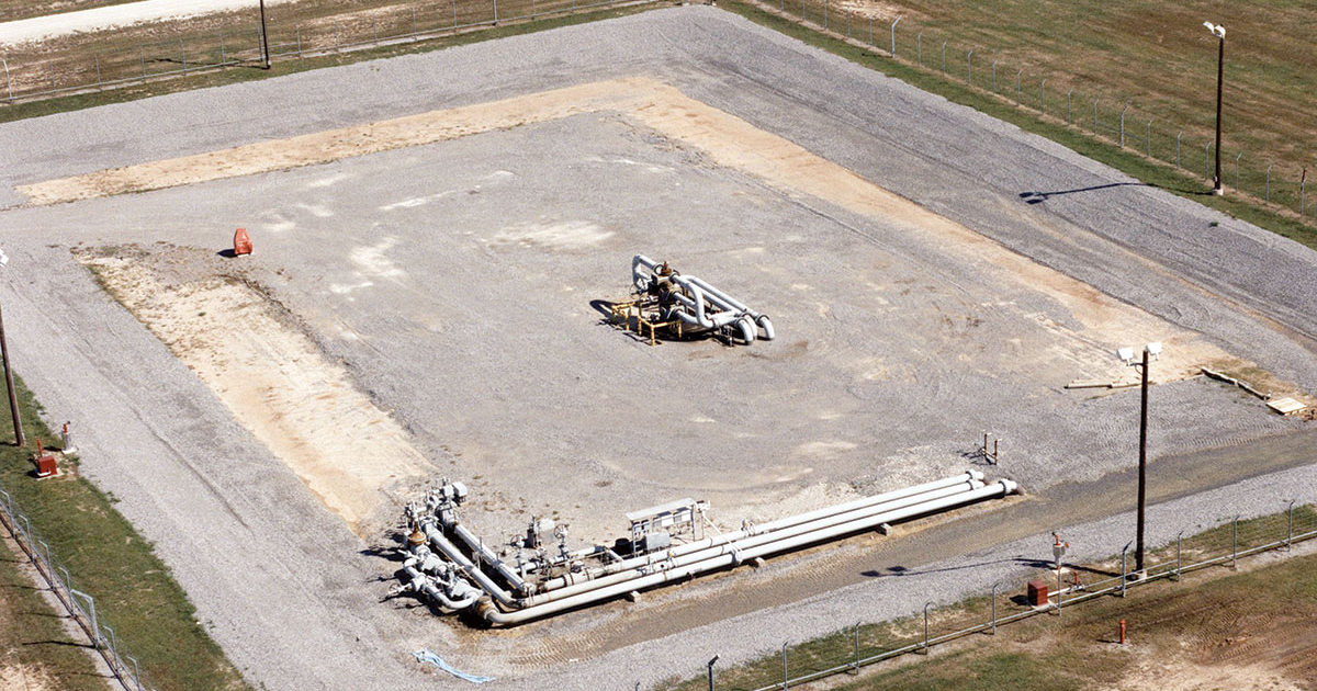 Oil tankers docked at a port, with a large quantity of crude oil visible.