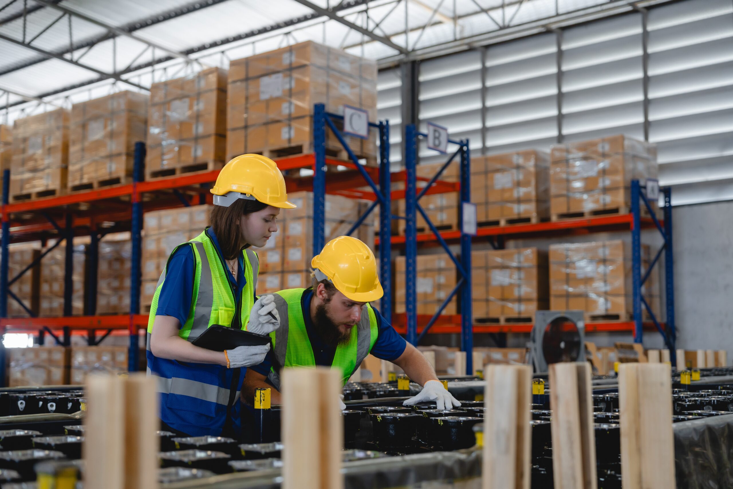 A logistics company employee carefully packing sensitive equipment during a company relocation.