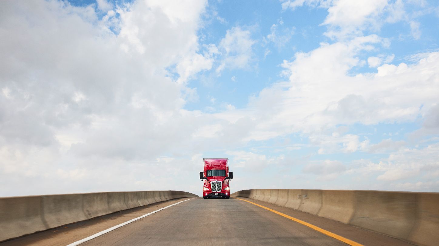 A Kodiak autonomous truck driving on a highway.