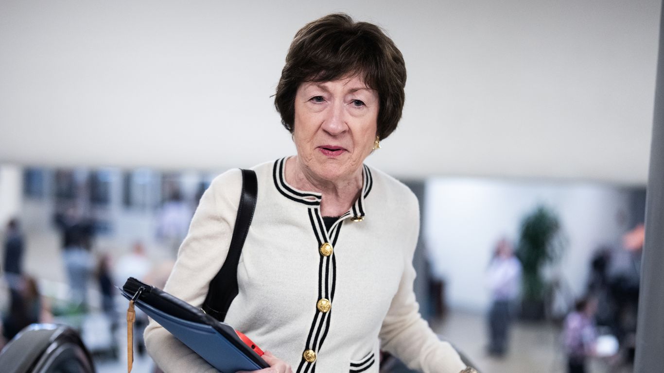 Susan Collins at Senate Appropriations Committee desk with Trump Cabinet officials in background